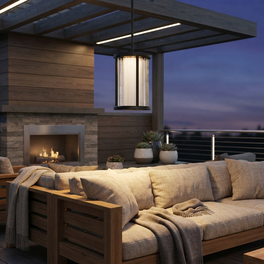Cylinder Pendant Light - Black and Clear Weather Sealed Outdoor Pendant Casting a Warm Even Glow over Courtyard and Patio Gatherings
