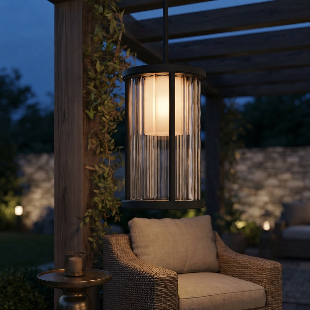 Cylinder Pendant Light - Black and Clear Weather Sealed Outdoor Pendant Casting a Warm Even Glow over Courtyard and Patio Gatherings