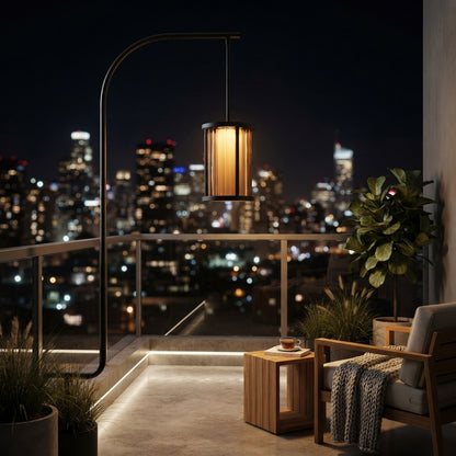 Cylinder Pendant Light - Black and Clear Weather Sealed Outdoor Pendant Casting a Warm Even Glow over Courtyard and Patio Gatherings
